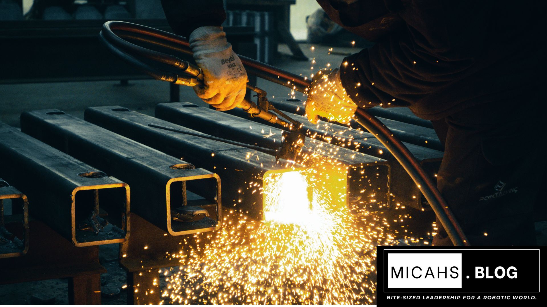 Humanoid robot welding in 2026 factory, Micah Vianaβs HICMF framework saves millions, manufacturing robotics integration 2026.